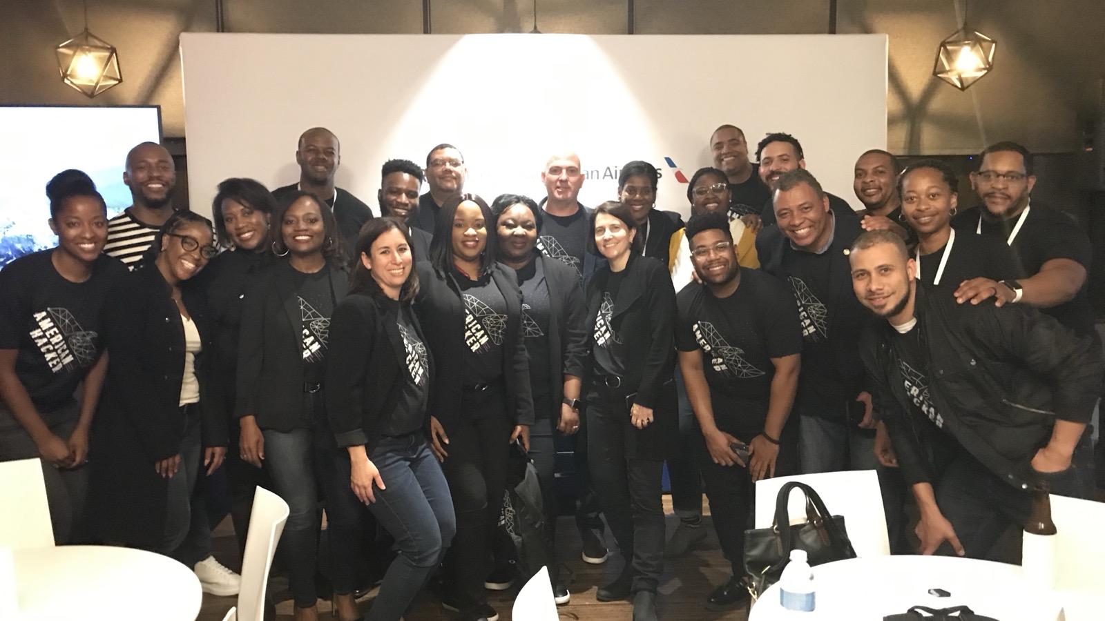 Group photo with Tre Stewart and American Airlines teammates after a workshop