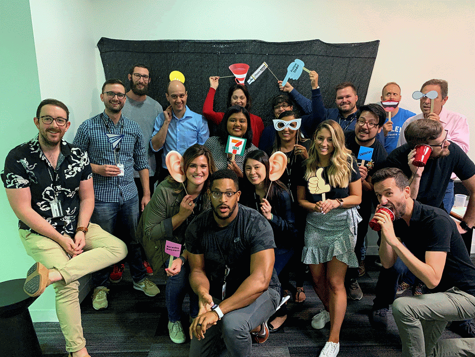 Animated American Airlines team photo with Tre Stewart and teammates holding playful props